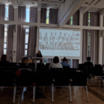 Photograph of Emma Christopher presenting at the ESTA workshop in Bonn on May 9th, 2025